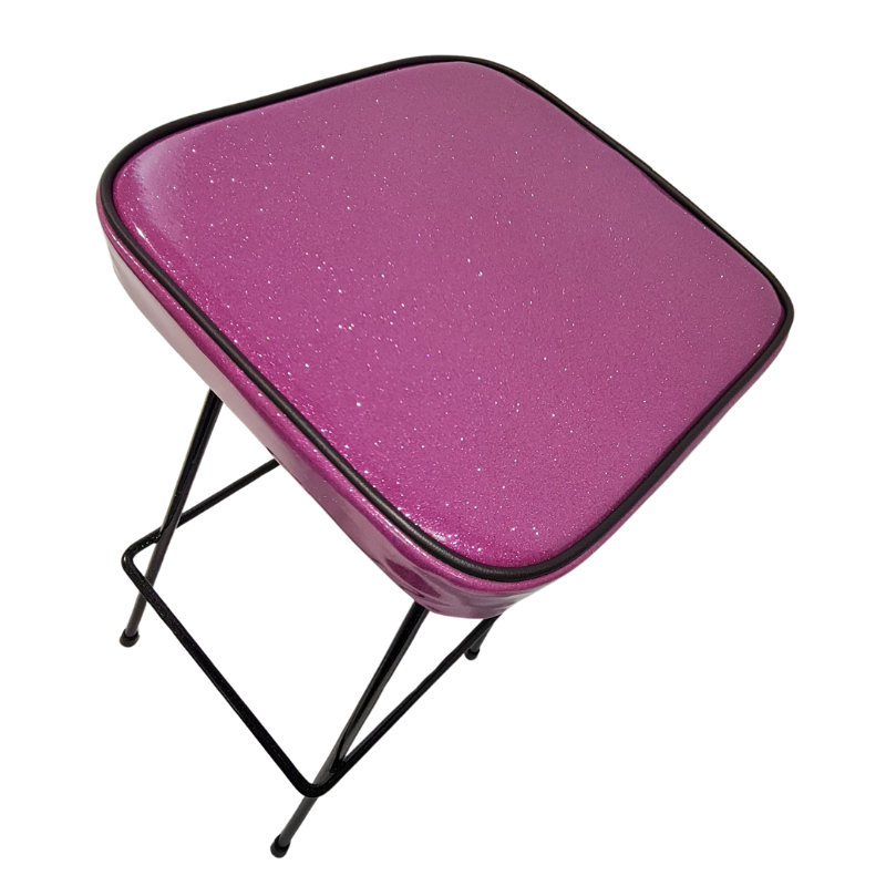 Pink glittery stool with black metal legs on a white background