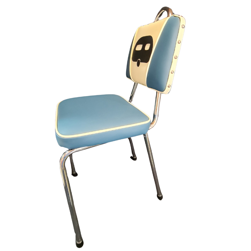 Vintage-style chair with blue seat and backrest with a caravan image on a white background