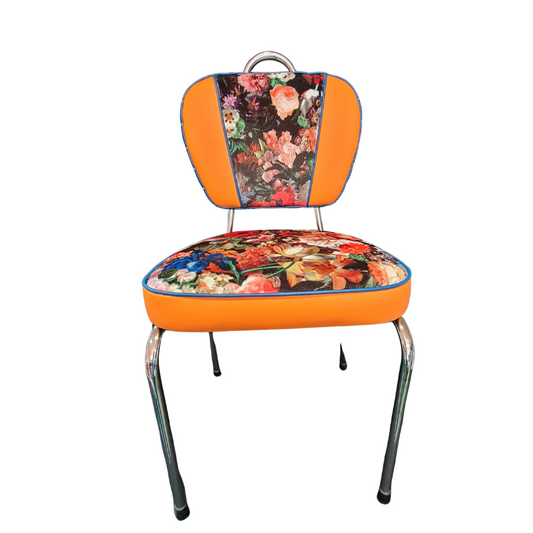 Chair with floral cushion and orange backrest on a white background