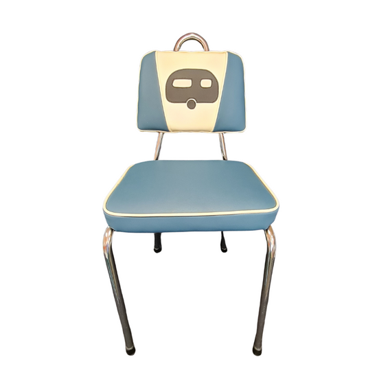 Vintage-style chair with blue seat and backrest with a black caravan and chrome legs on a white background