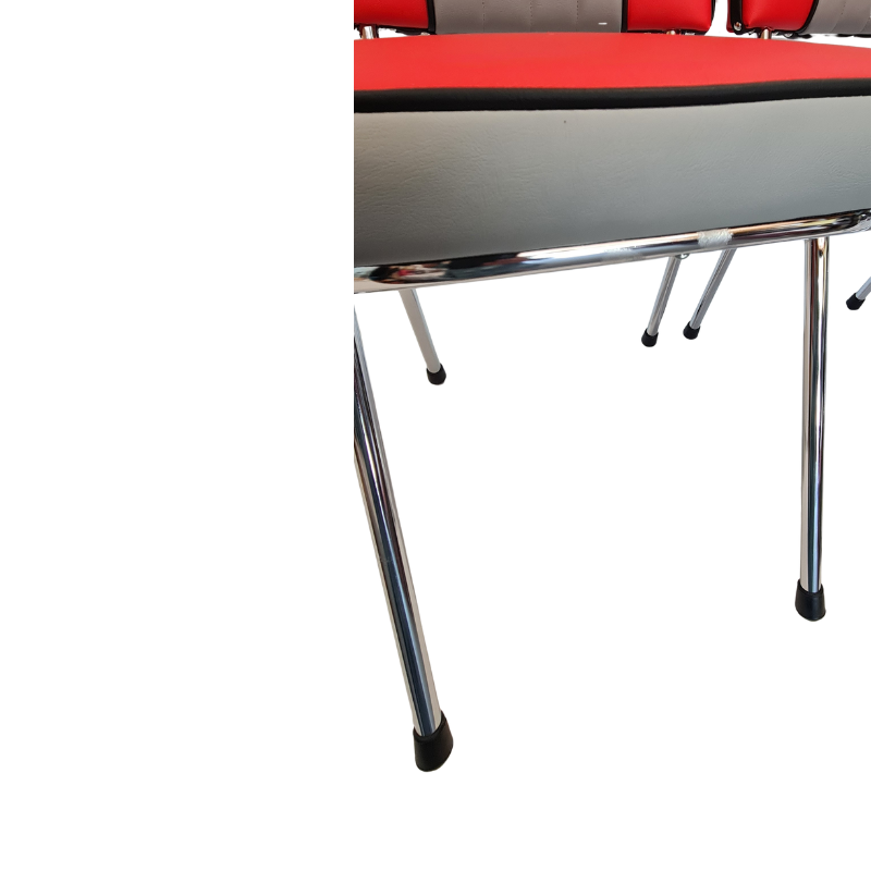 Close-up of the chrome frame showing where anti rust paint has been put on a little aged piece with red top and metal legs on a white background