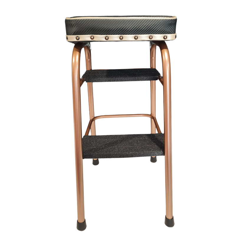 A two-step ladder stool with a copper-colored metal frame and black textured fabric cushions on the seat, steps, and top panel.