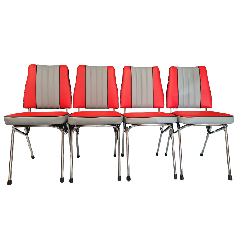 Four matching mid-century modern dining chairs with red and grey upholstered seats and backs, supported by chrome metal legs, shown against a plain white background.