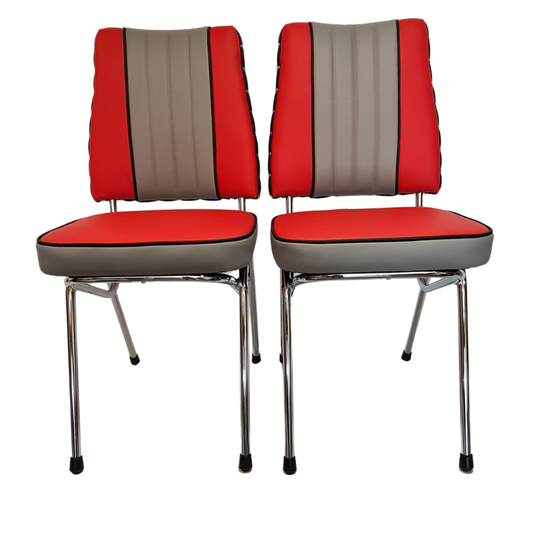 Two red and grey cushioned chairs with metal legs on a white background