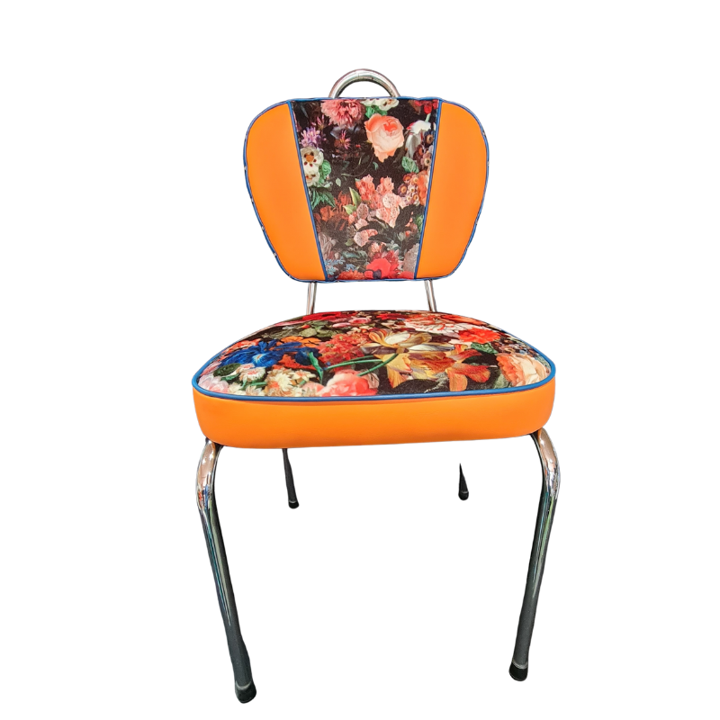 Chair with floral cushion and orange backrest on a white background