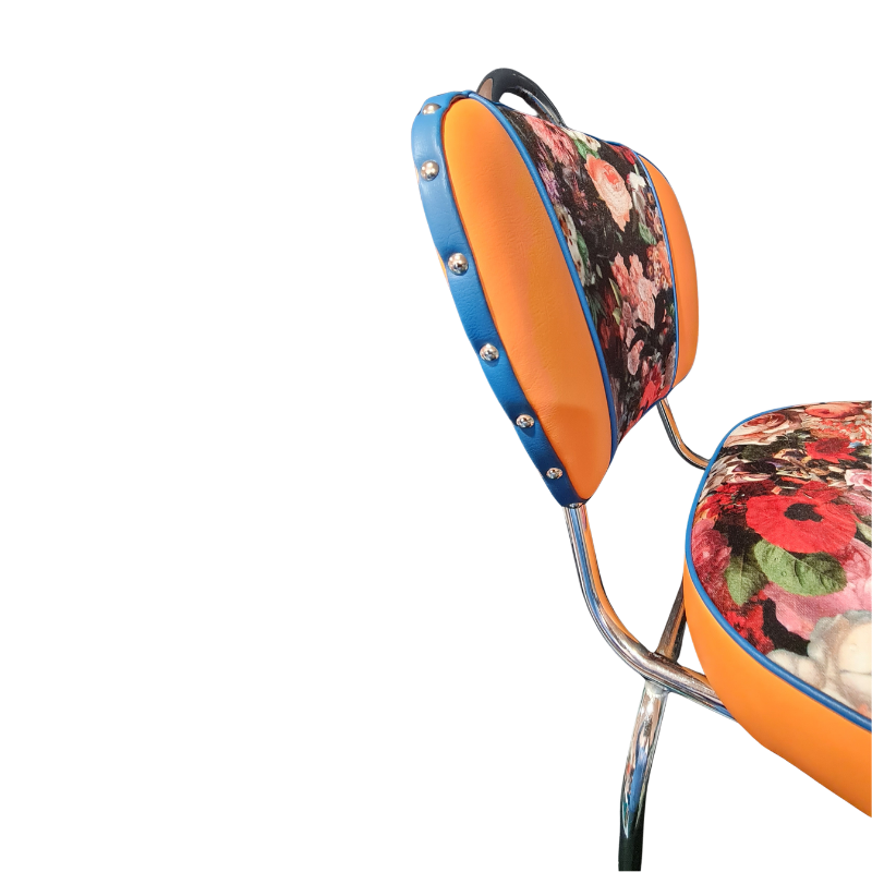Chair with floral-patterned seat and backrest on a white background