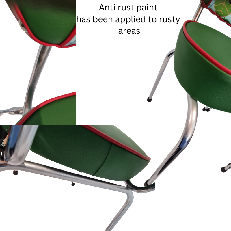 Green chair with red accents and a metal frame, showing anti-rust paint application.