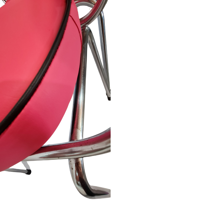Close-up of a pink chair with chrome frame on a white background