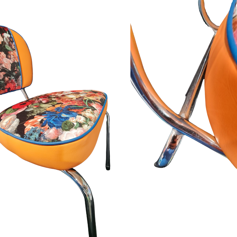 Chair with floral-patterned seat and backrest on a white background