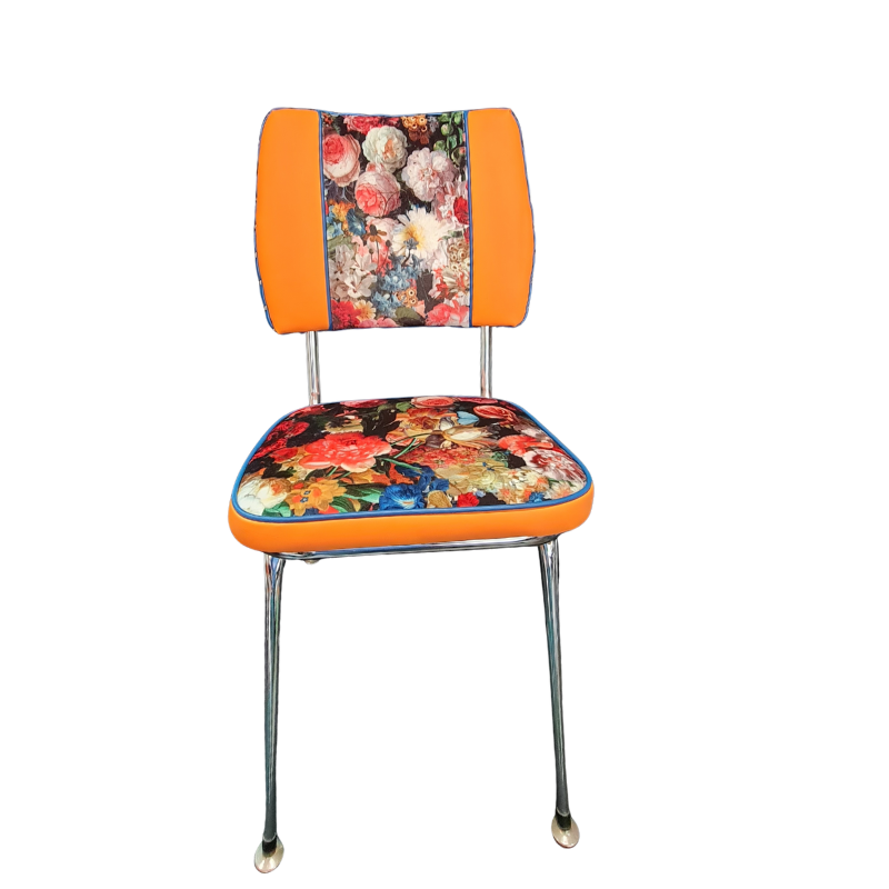 Chair with floral-patterned seat and backrest on an orange background