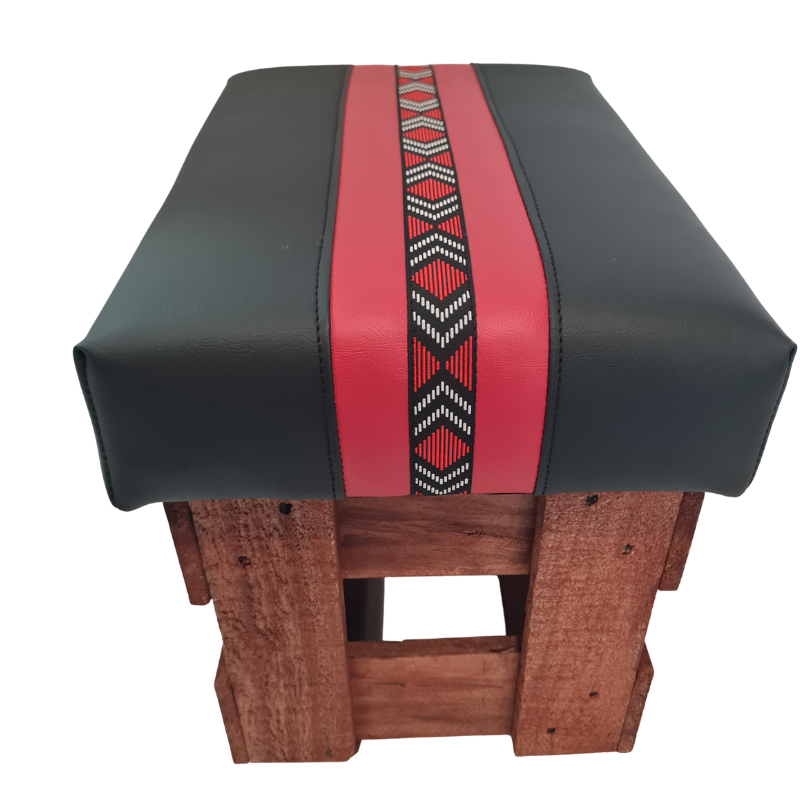 Black and red footstool photo on a white background