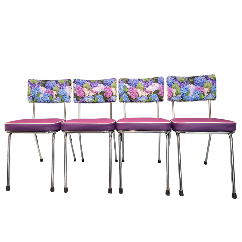 Four matching dining chairs with hydrangea floral backrests and purple-pink upholstered seats, shown on a plain white background.