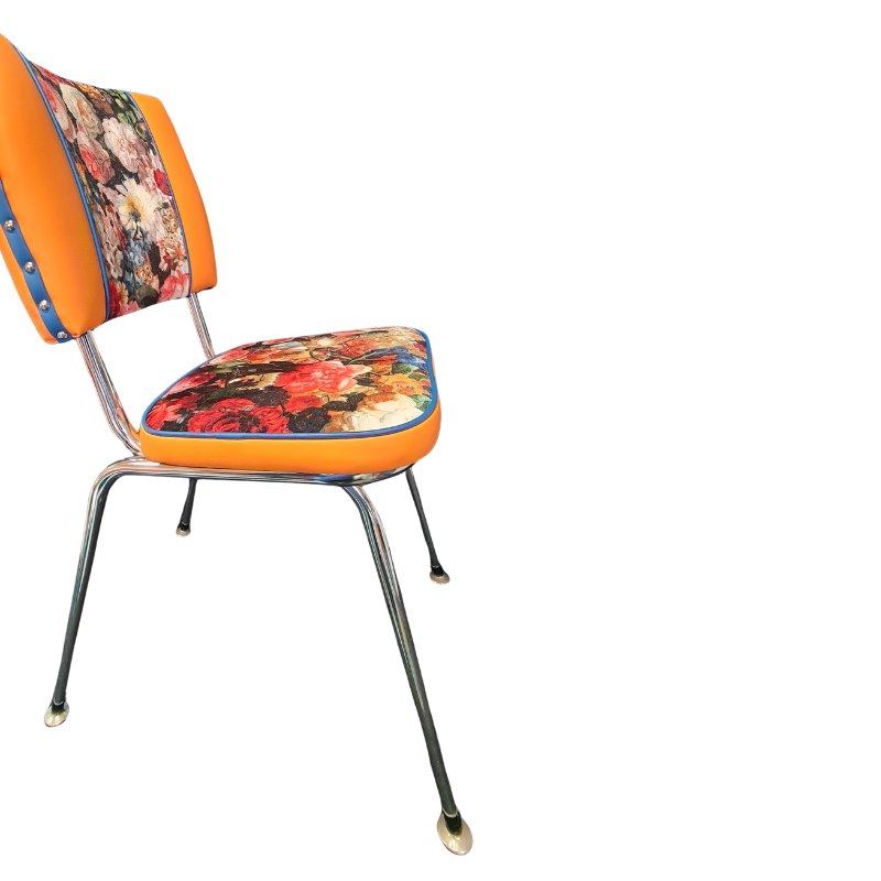 Vintage-style chair with floral cushion on a white background