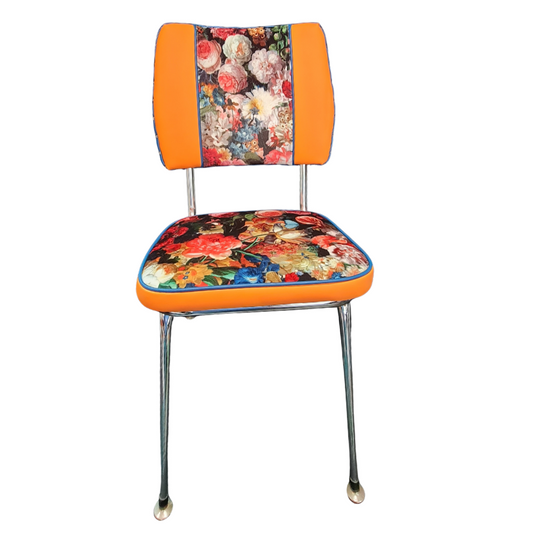Chair with floral seat and backrest on an orange background